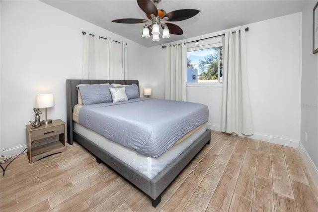 a bedroom with a bed and window