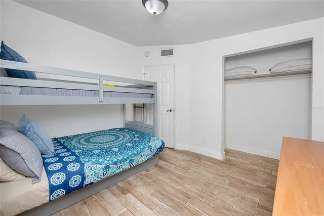 a bedroom with a bed and a walk in closet