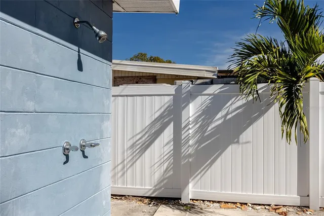 a view of staircase with white walls and a window