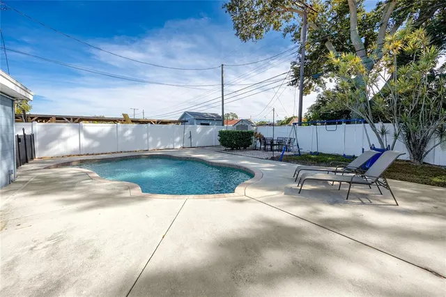 a view of a backyard with sitting area
