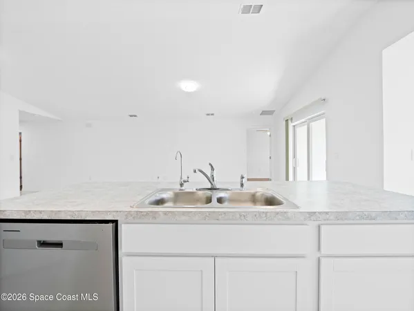a stove top oven sitting inside of a kitchen