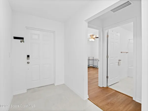 a view of a kitchen with a sink and a window