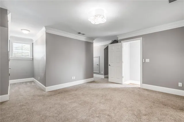 a view of an empty room and a window