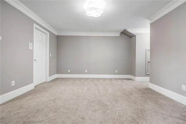 a view of a hallway with wooden floor and entryway