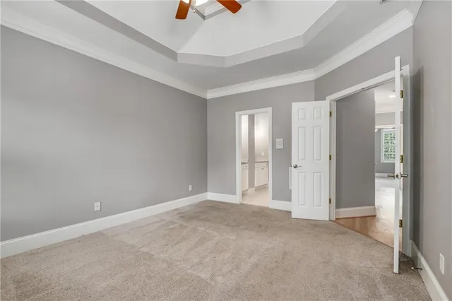 a view of an empty room with windows