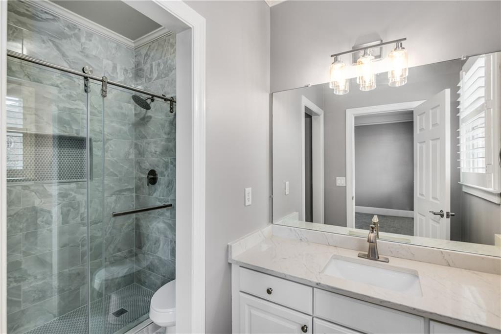2586 Brookhaven Chase Lane Northeast Atlanta, GA 30319 - Photo 34 of 51 a bathroom with a sink a toilet and shower