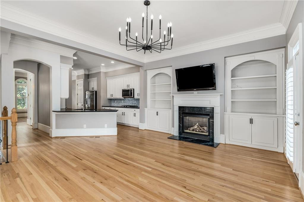 2586 Brookhaven Chase Lane Northeast Atlanta, GA 30319 - Photo 44 of 51 a view of a living room kitchen with a flat screen tv