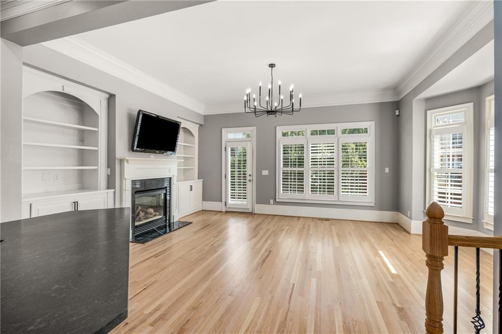 2586 Brookhaven Chase Lane Northeast Atlanta, GA 30319 - Photo 46 of 51 a view of a livingroom with wooden floor a fireplace and windows