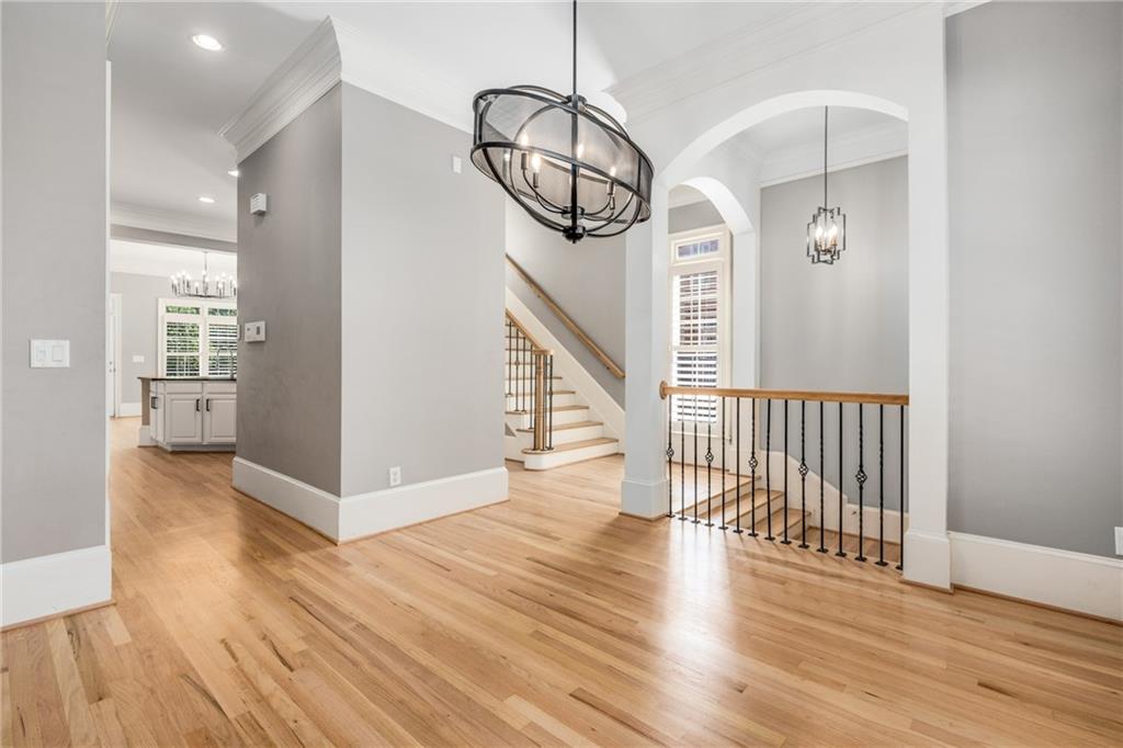 2586 Brookhaven Chase Lane Northeast Atlanta, GA 30319 - Photo 48 of 51 a view of a hallway with wooden floor staircase and a living room