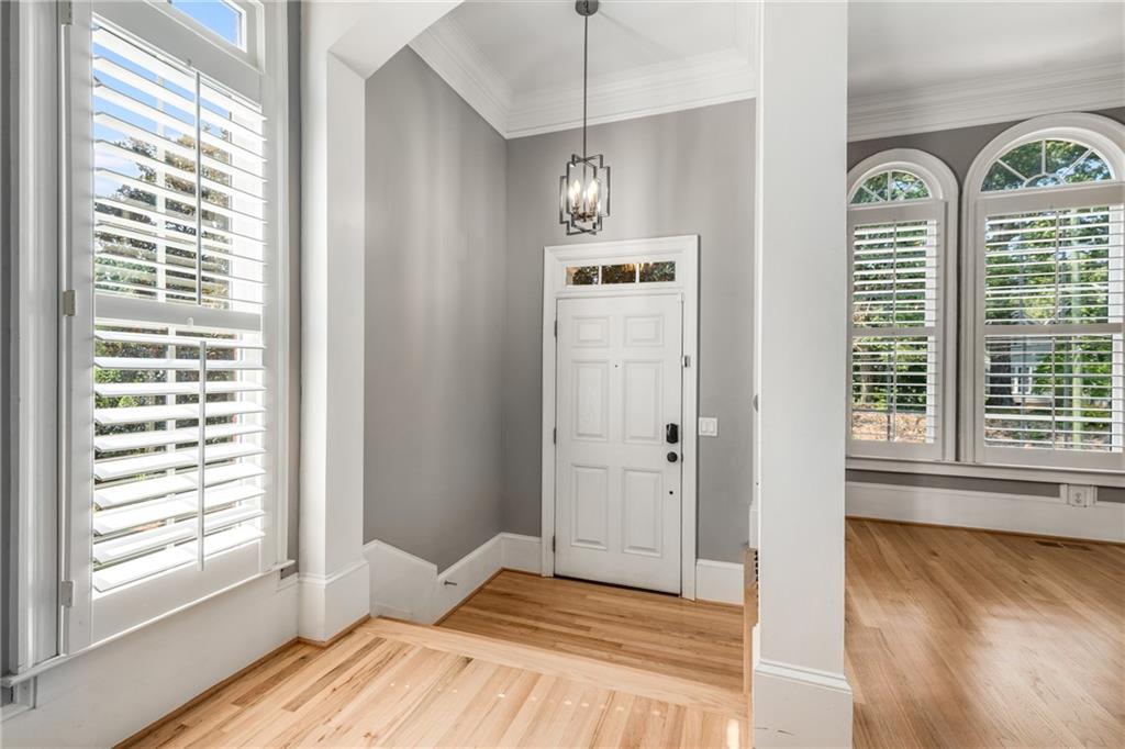 2586 Brookhaven Chase Lane Northeast Atlanta, GA 30319 - Photo 50 of 51 a view of empty room with wooden floor and fan
