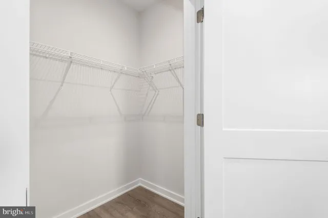 a bathroom with a double vanity sink toilet and shower