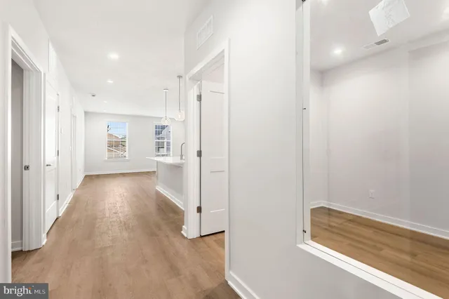 an empty room with wooden floor