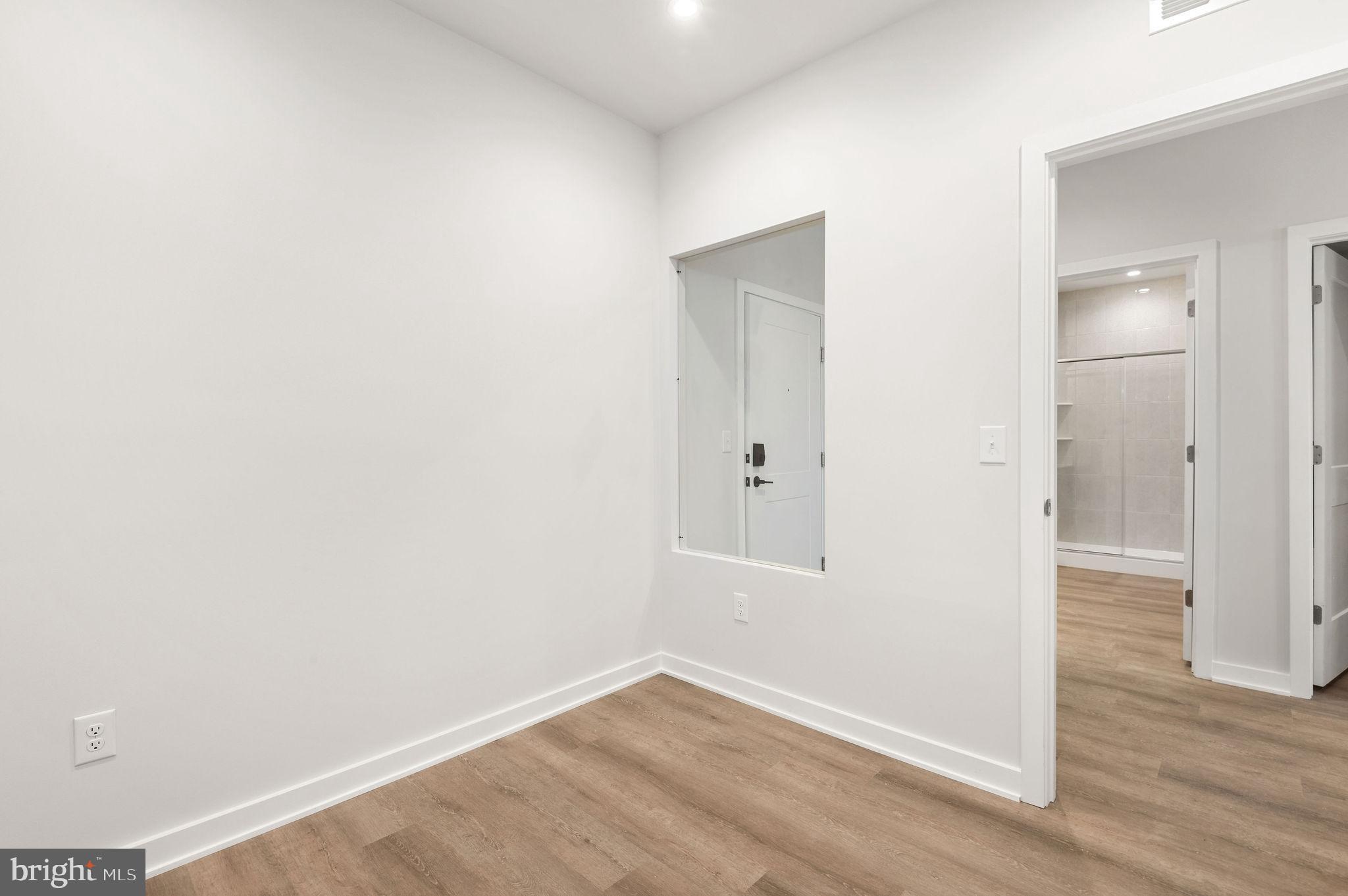 26 South York Road, Unit 406 Hatboro, PA 19040 - Photo 10 of 55 an empty room with wooden floor