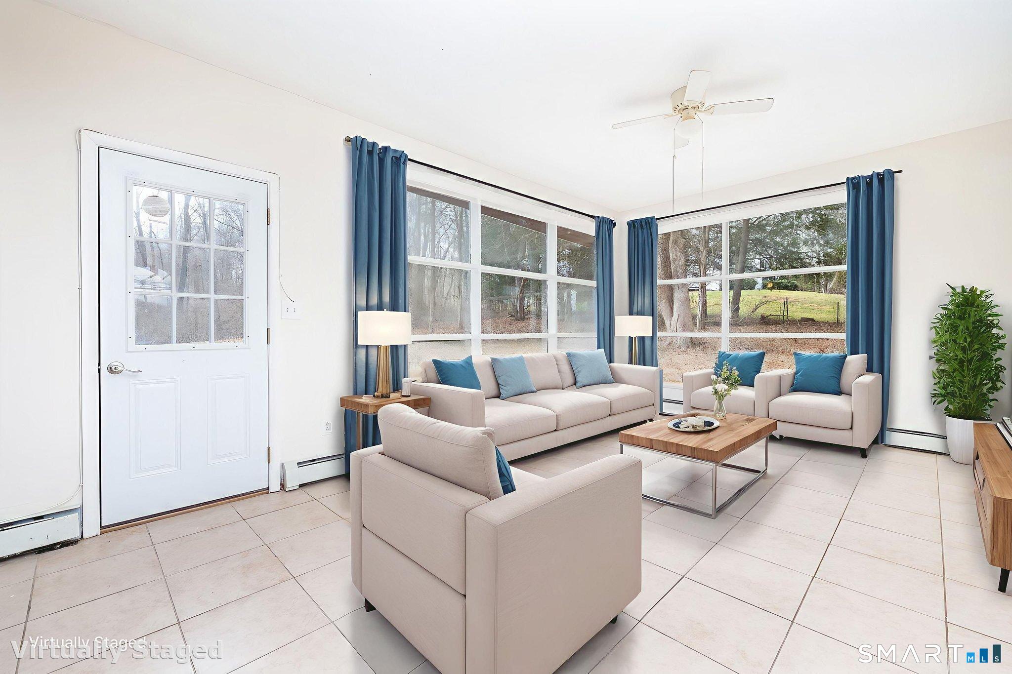 461 Pond Road Franklin, CT 06254 - Photo 5 of 35 a living room with furniture and large windows