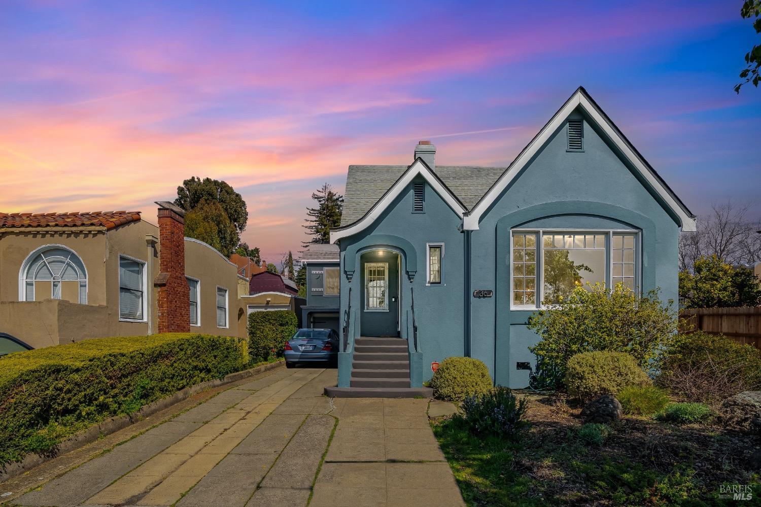 a front view of a house with garden