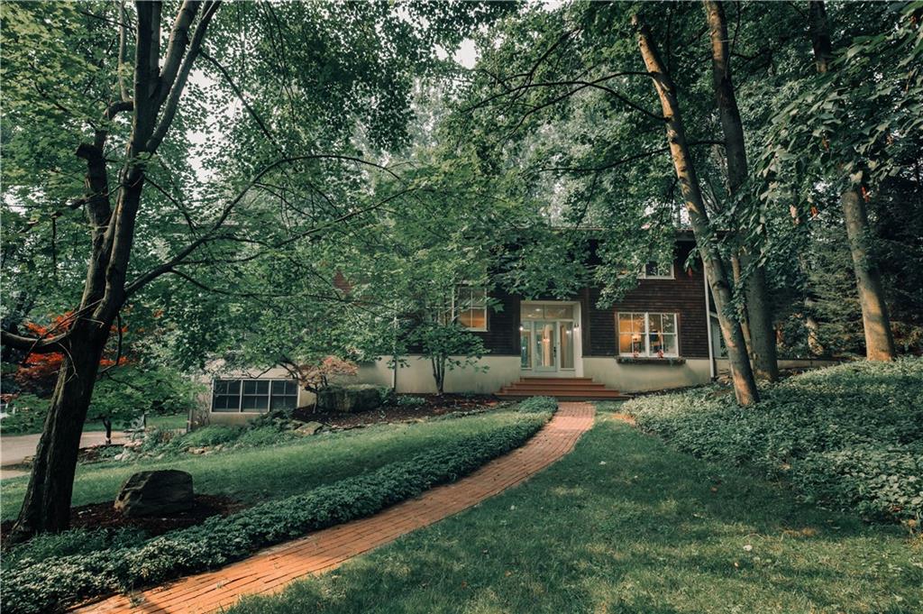 400 Forest Ridge Road Indiana, PA 15701 - Photo 48 of 48 a front view of a house with a garden and trees