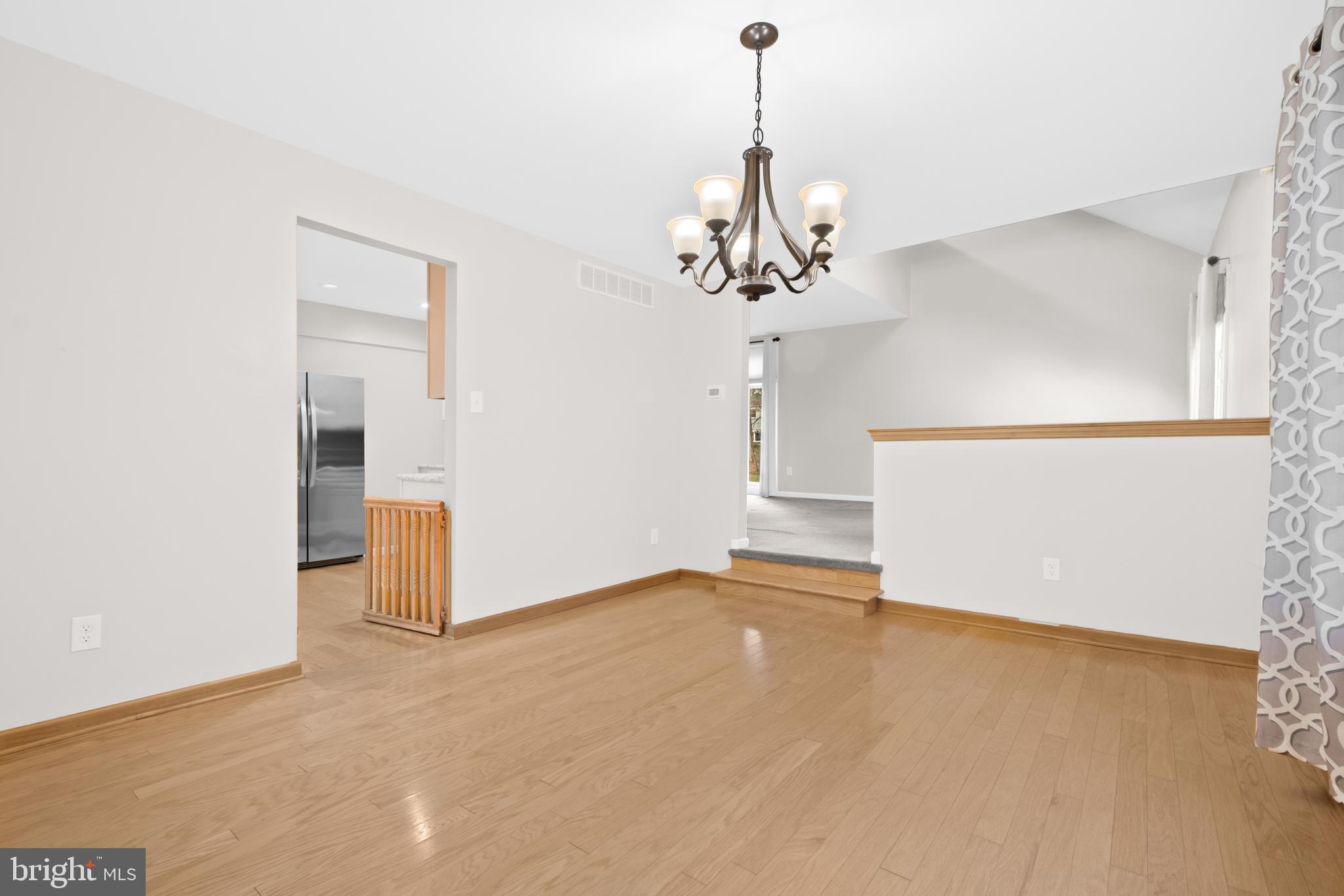 127 Heath Road Medford, NJ 08055 - Photo 11 of 63 a view of a livingroom with a chandelier