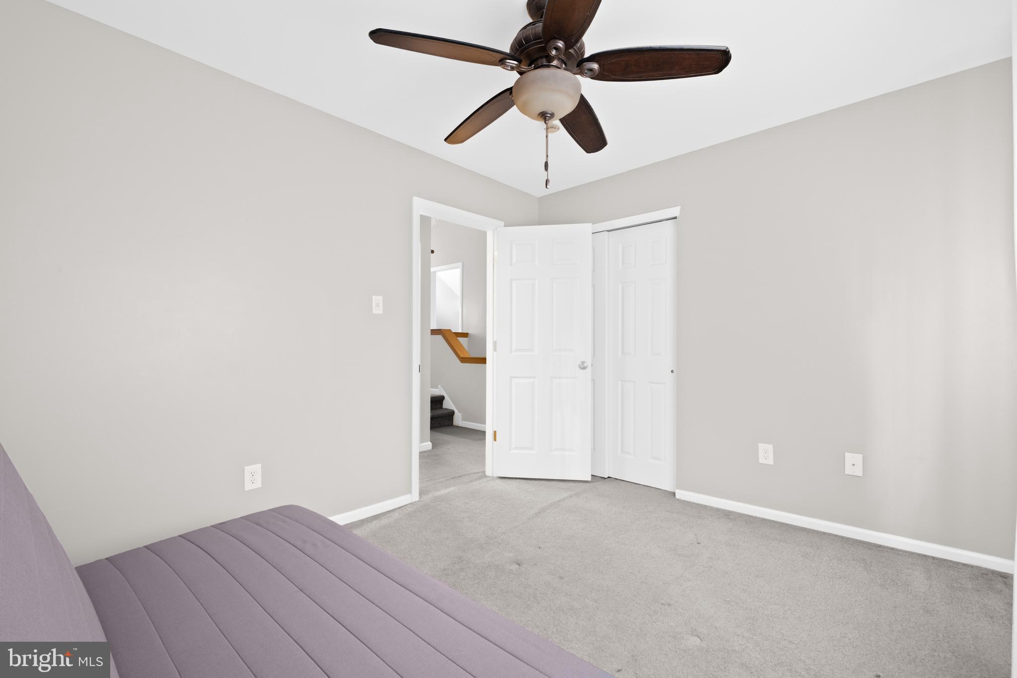 127 Heath Road Medford, NJ 08055 - Photo 43 of 63 an empty room with a ceiling fan and carpet