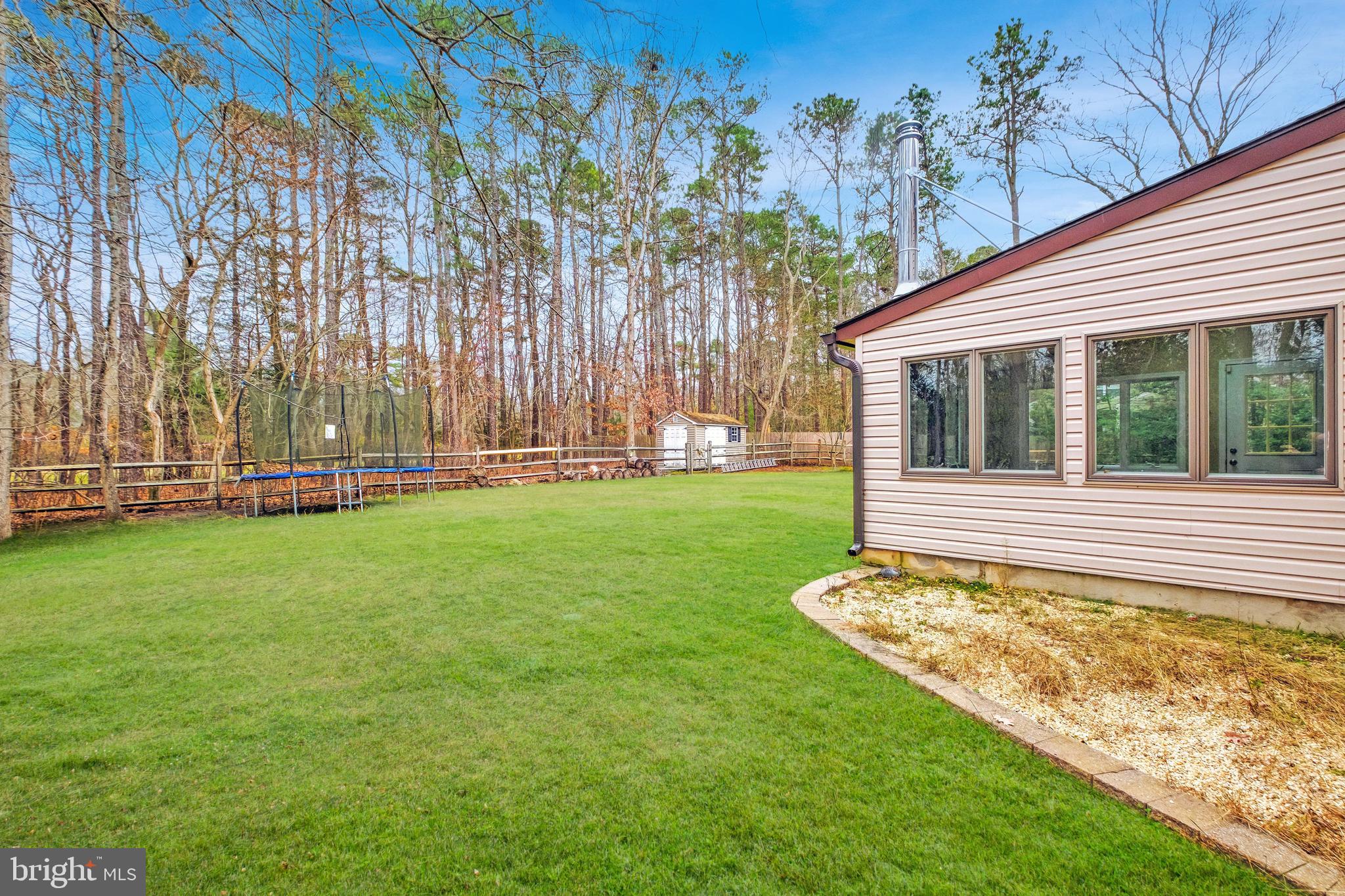 127 Heath Road Medford, NJ 08055 - Photo 51 of 63 a view of a backyard with a garden