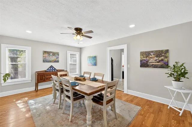 a view of a dining room with furniture window and wooden floor