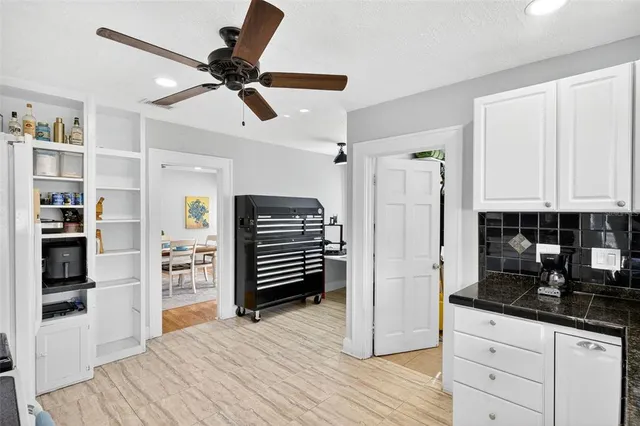 a kitchen with stainless steel appliances a refrigerator and cabinets