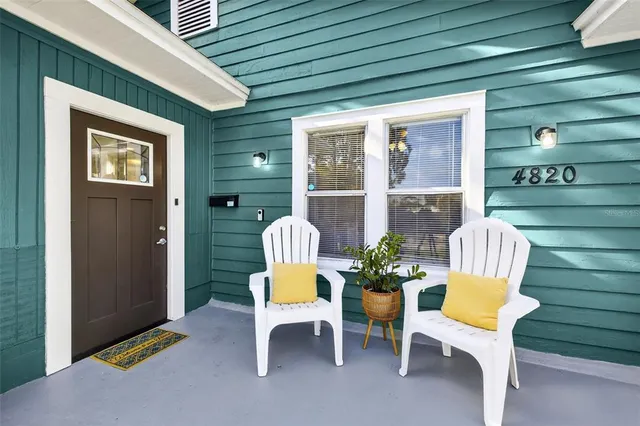 a view of a chair and table in the balcony