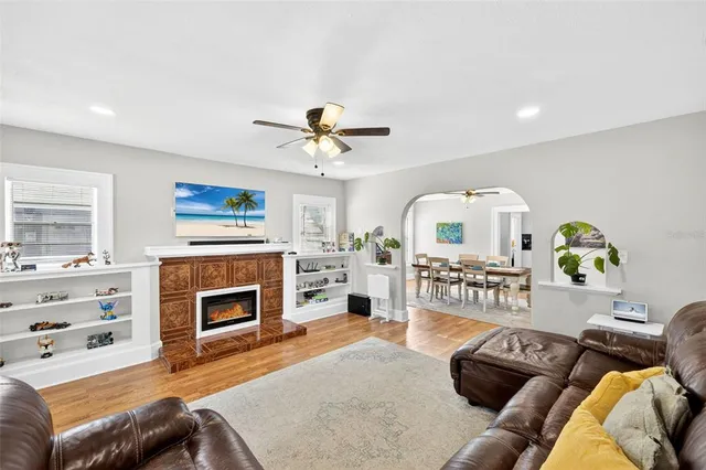 a living room with furniture and a fireplace