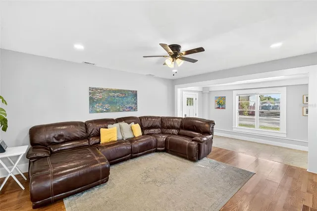 a living room with furniture and a window