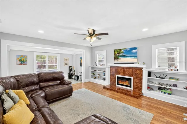 a living room with furniture and a fireplace