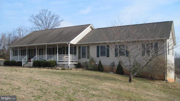 14011 Reva Road Boston, VA 22713 - Photo 1 of 18 a front view of a house with garden