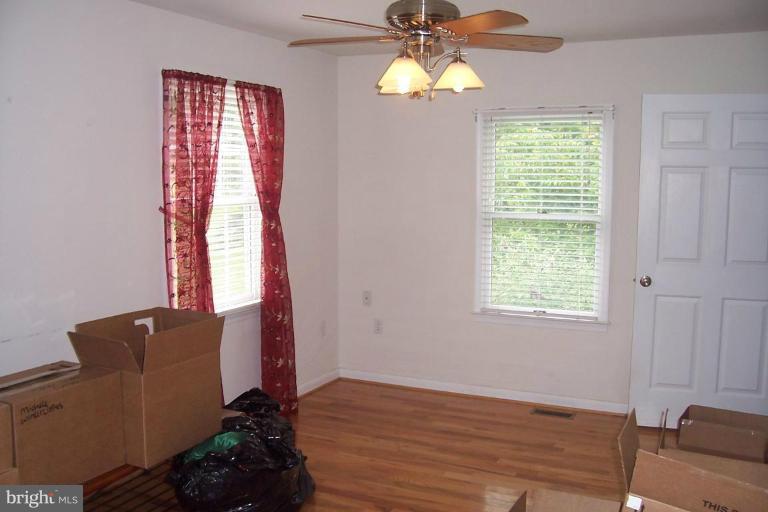 14011 Reva Road Boston, VA 22713 - Photo 17 of 18 a view of a livingroom with furniture and chandelier