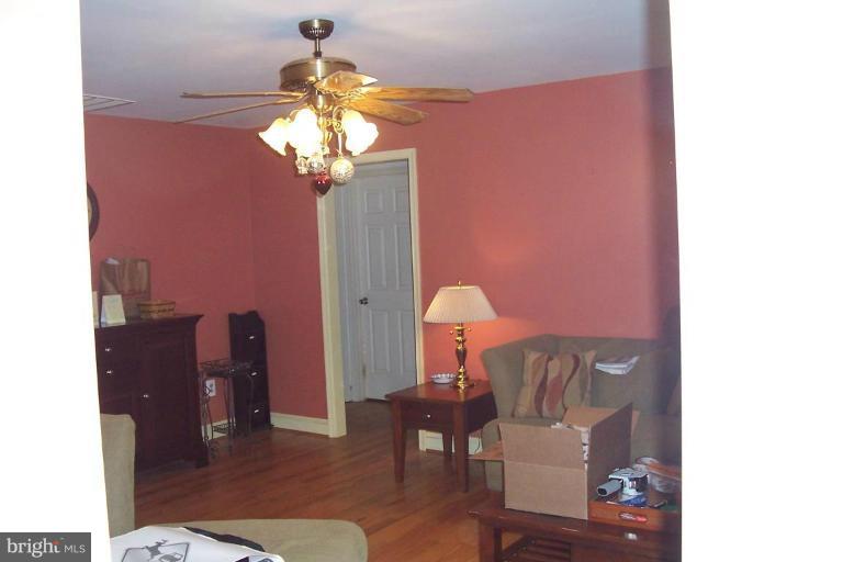 14011 Reva Road Boston, VA 22713 - Photo 4 of 18 a living room with furniture and a chandelier