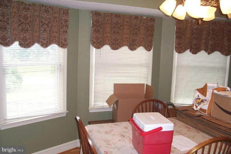 14011 Reva Road Boston, VA 22713 - Photo 6 of 18 a balcony with table and chairs