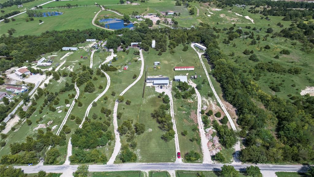 958 Watkins Road Sherman, TX 75090 - Photo 23 of 23 Expansive green landscape featuring multiple structures, numerous driveways, and scattered mature trees