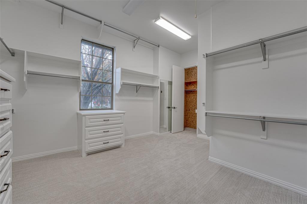2216 Kings Pass Heath, TX 75032 - Photo 18 of 40 a view of an empty walk in closet