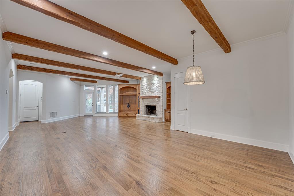 2216 Kings Pass Heath, TX 75032 - Photo 20 of 40 a view of a room with wooden floor and fireplace