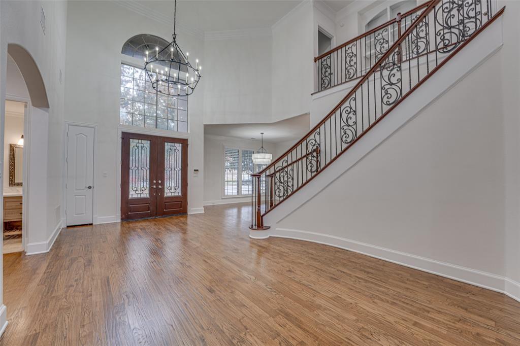 2216 Kings Pass Heath, TX 75032 - Photo 23 of 40 a view of entryway and hall with wooden floor