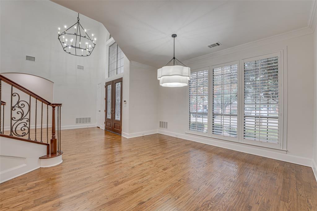 2216 Kings Pass Heath, TX 75032 - Photo 24 of 40 a view of an empty room with wooden floor and a window
