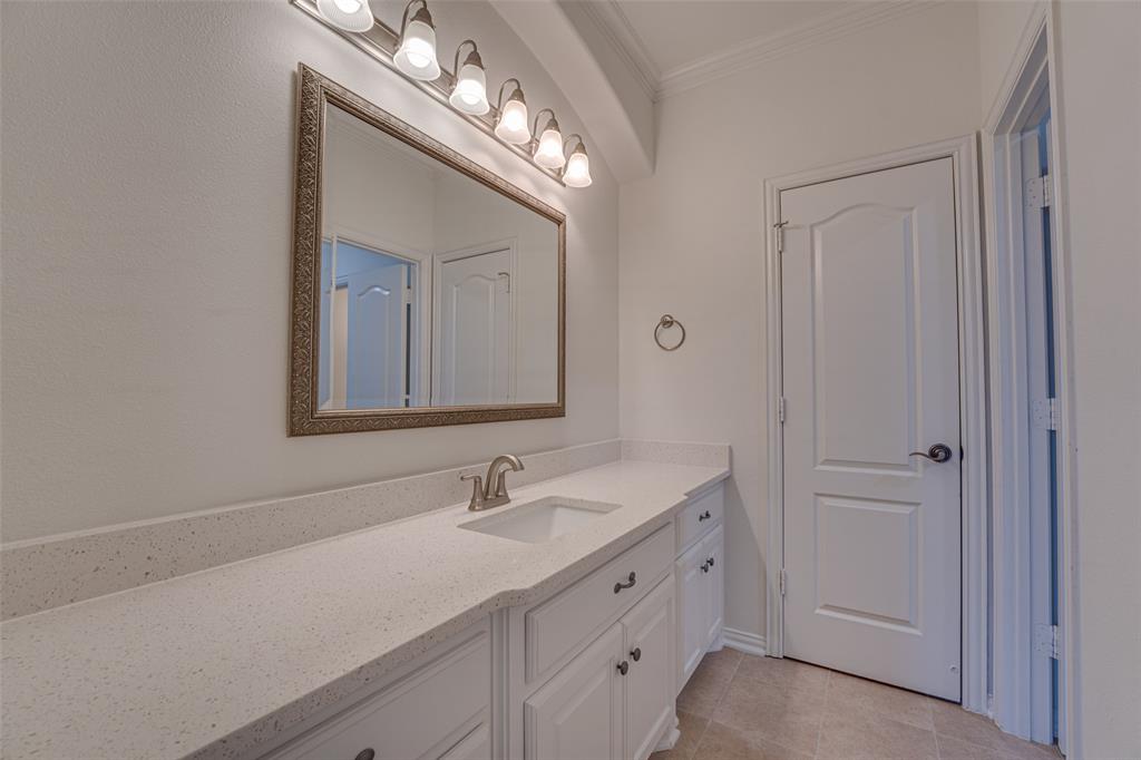 2216 Kings Pass Heath, TX 75032 - Photo 31 of 40 a bathroom with a double vanity sink and a mirror
