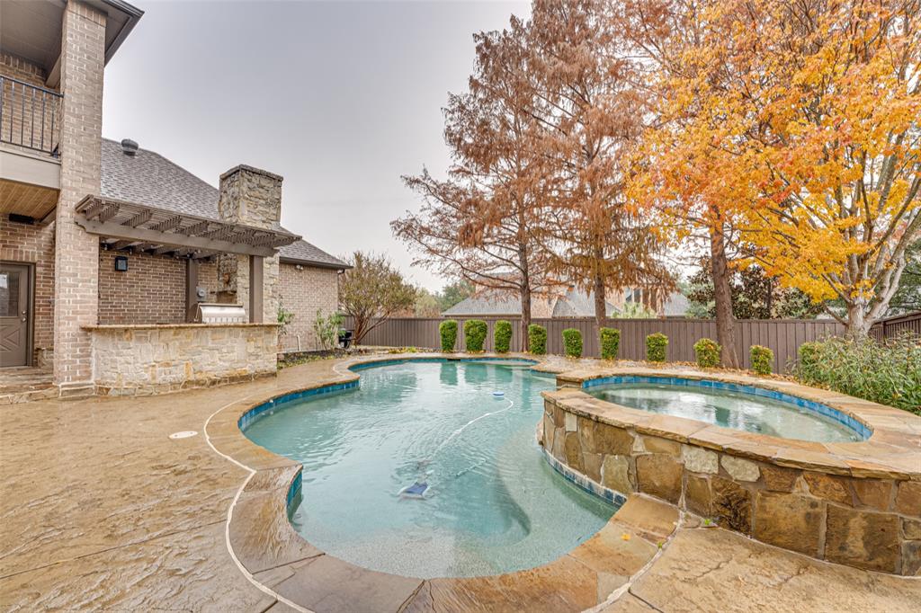 2216 Kings Pass Heath, TX 75032 - Photo 37 of 40 a view of a swimming pool with a patio