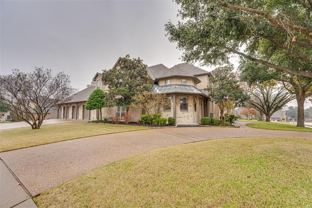2216 Kings Pass Heath, TX 75032 - Photo 39 of 40 a front view of house with yard and trees