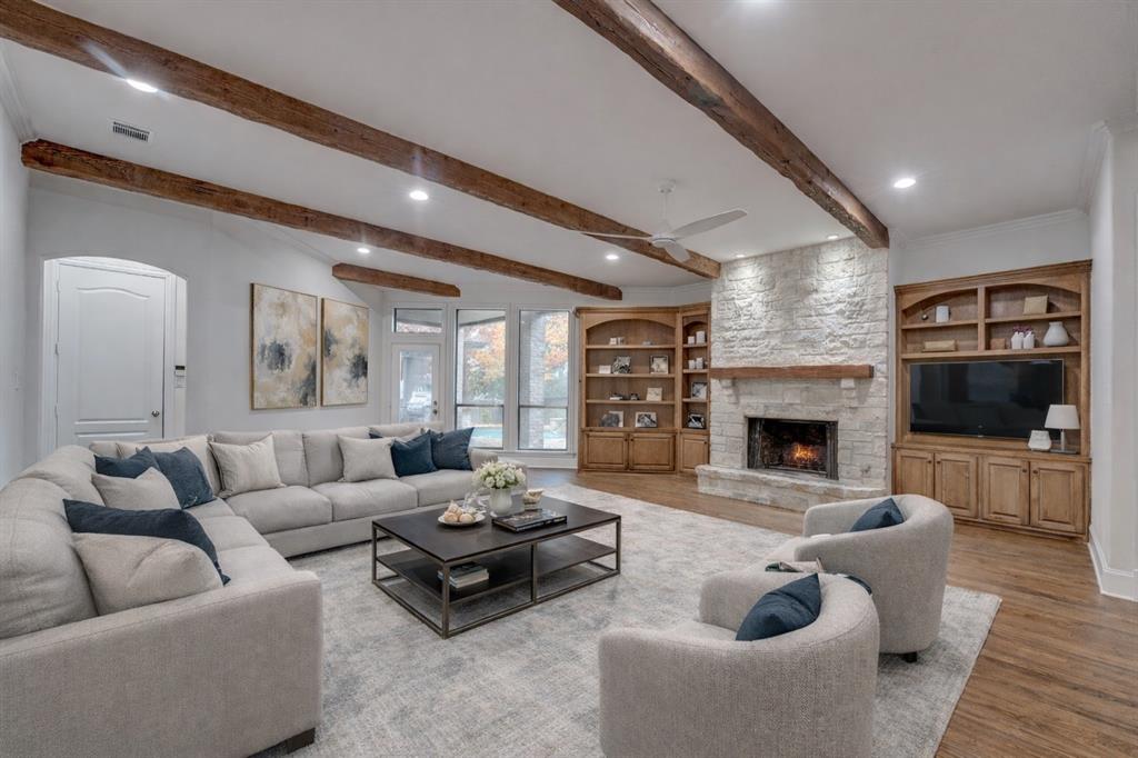 2216 Kings Pass Heath, TX 75032 - Photo 4 of 40 a living room with furniture and a fireplace