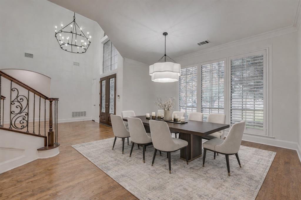 2216 Kings Pass Heath, TX 75032 - Photo 7 of 40 a view of a dining room with furniture wooden floor and chandelier