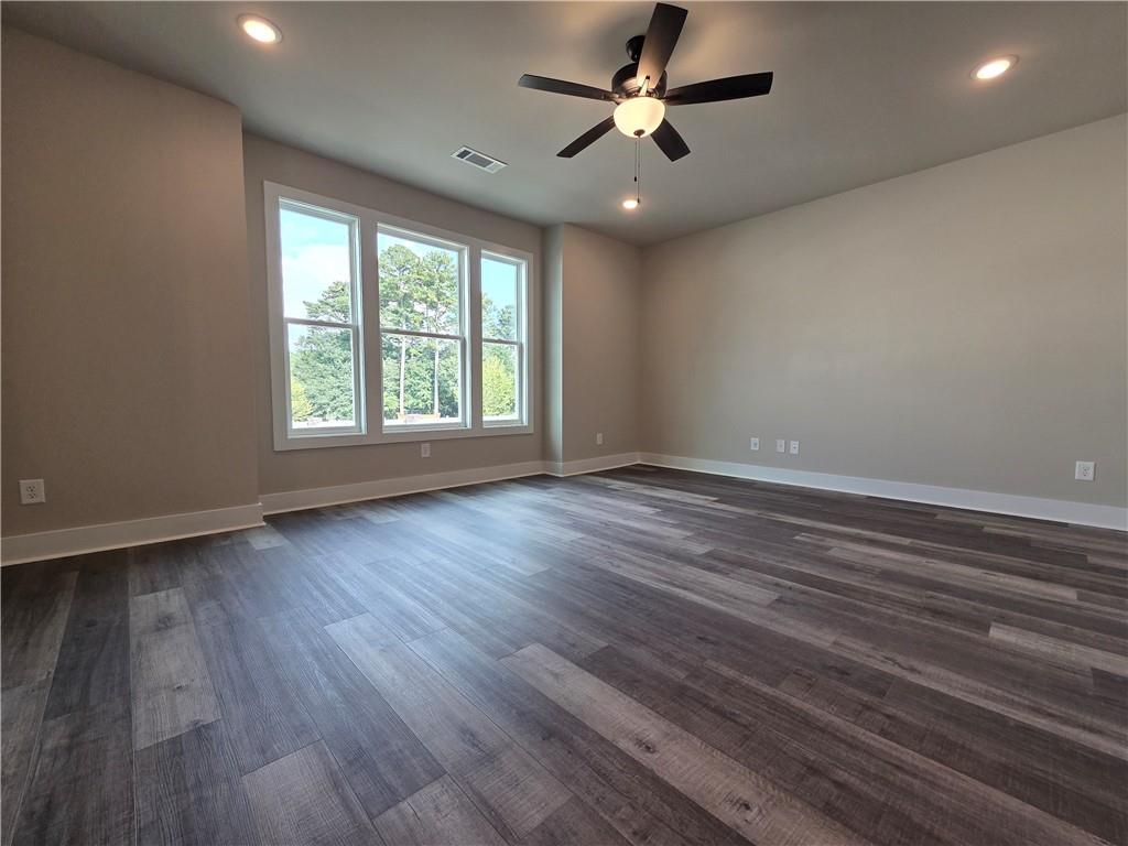 2 Rock Pk Way, Unit 13 Tucker, GA 30084 - Photo 19 of 39 an empty room with wooden floor and windows