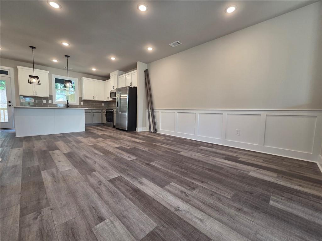 2 Rock Pk Way, Unit 13 Tucker, GA 30084 - Photo 23 of 39 a view of kitchen with cabinets and wooden floor