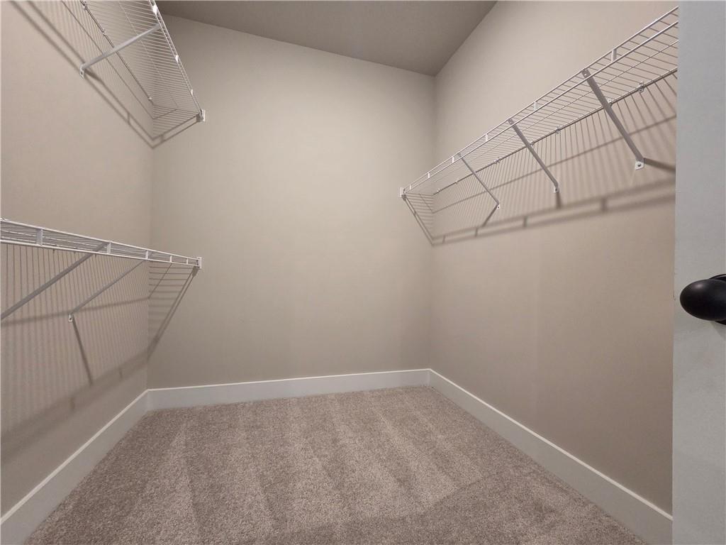 2 Rock Pk Way, Unit 13 Tucker, GA 30084 - Photo 32 of 39 a view of a room with racks on the wall