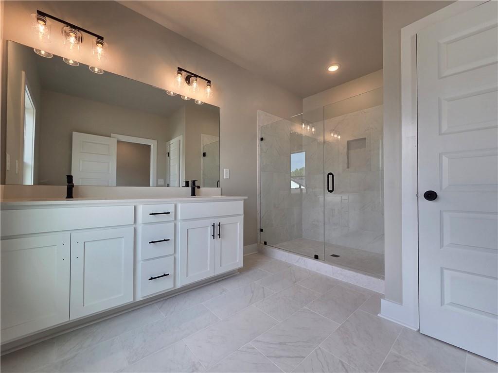 2 Rock Pk Way, Unit 13 Tucker, GA 30084 - Photo 35 of 39 a spacious bathroom with double sink shower and mirror