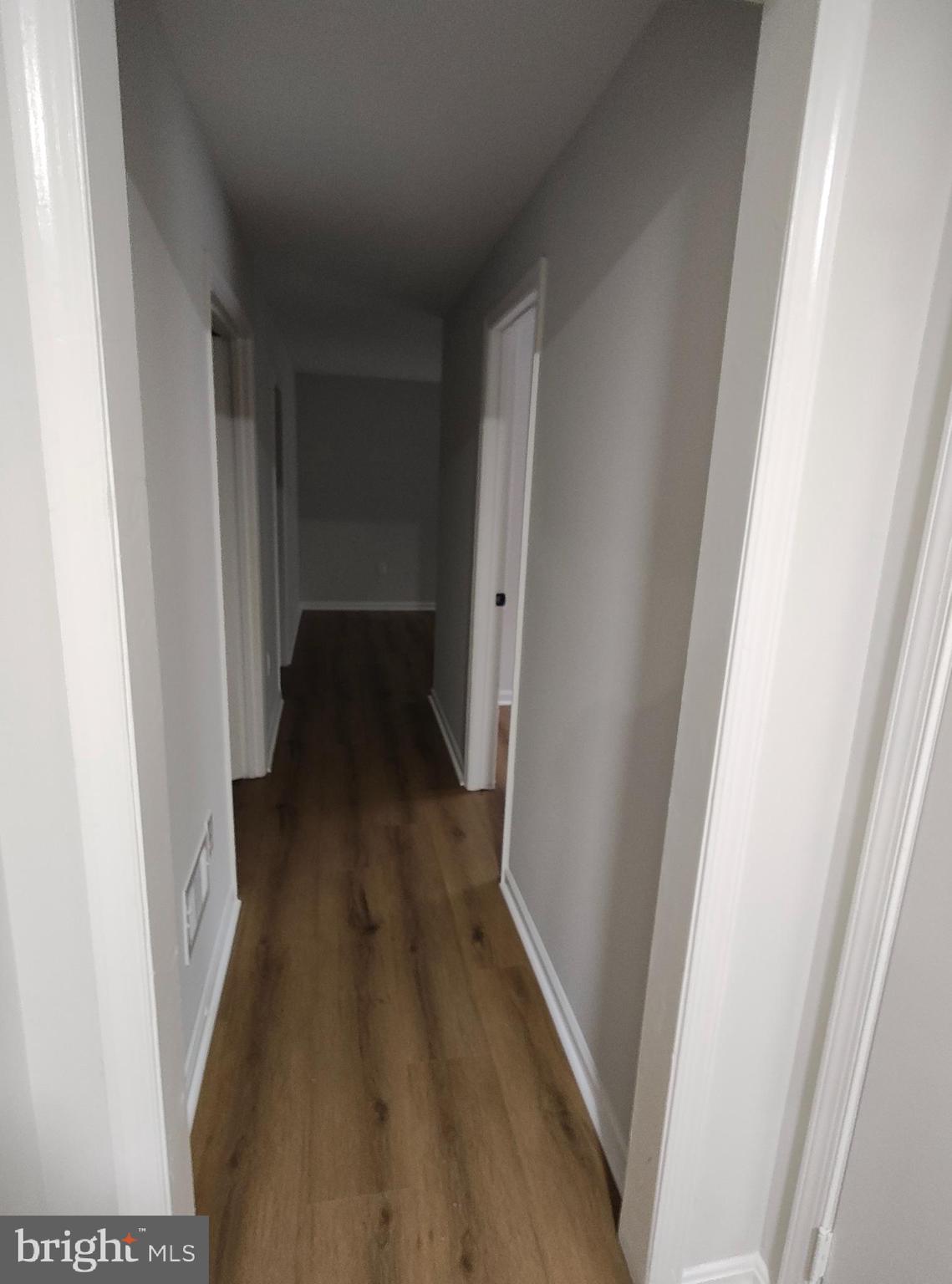 15712 Brandywine Road Dumfries, VA 22025 - Photo 14 of 15 a view of a hallway and wooden floor