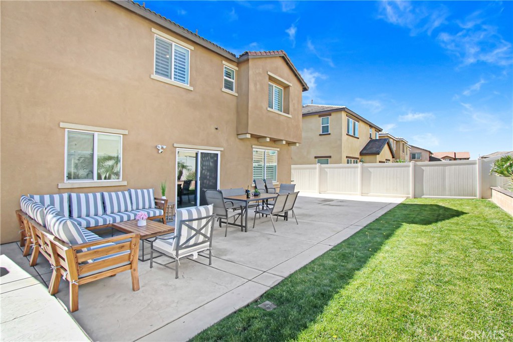 11079 Longfield Lane Eastvale, CA 91752 - Photo 15 of 16 a view of a house with backyard and sitting area