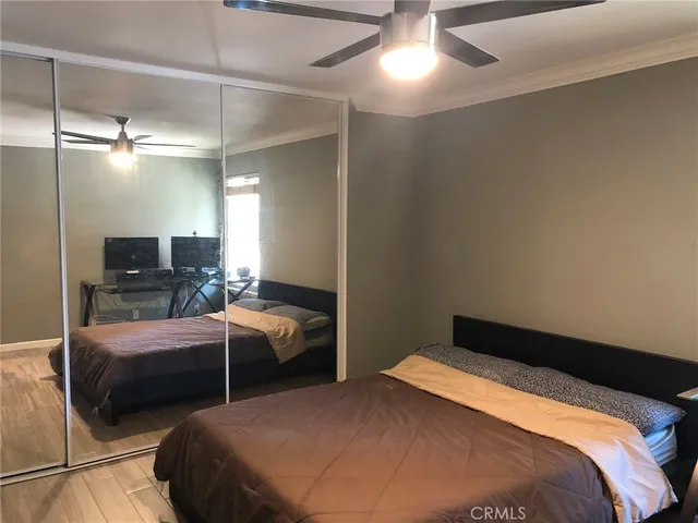 a bedroom with two beds and a view of bathroom